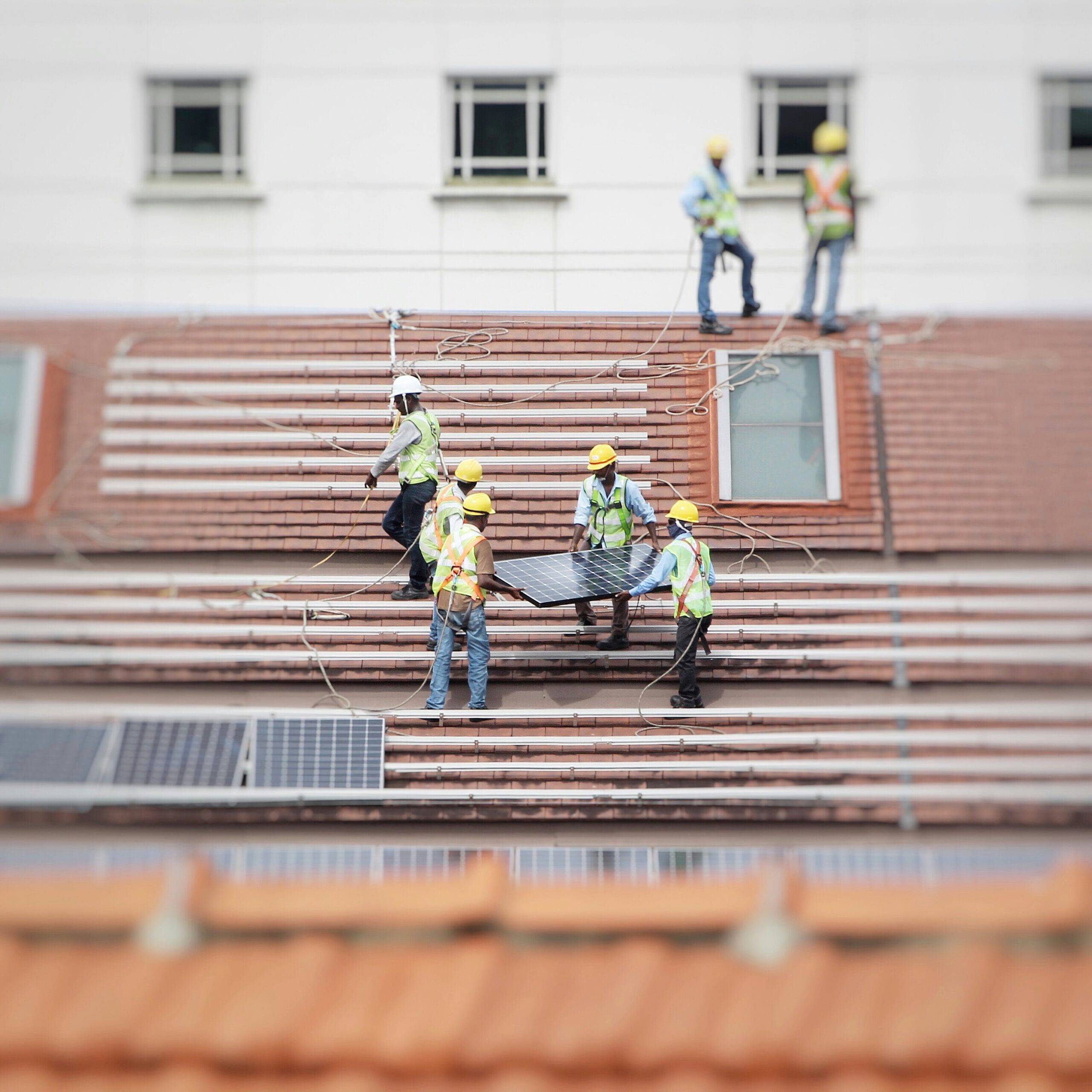 Installing PV panels in a routine solar installation.
